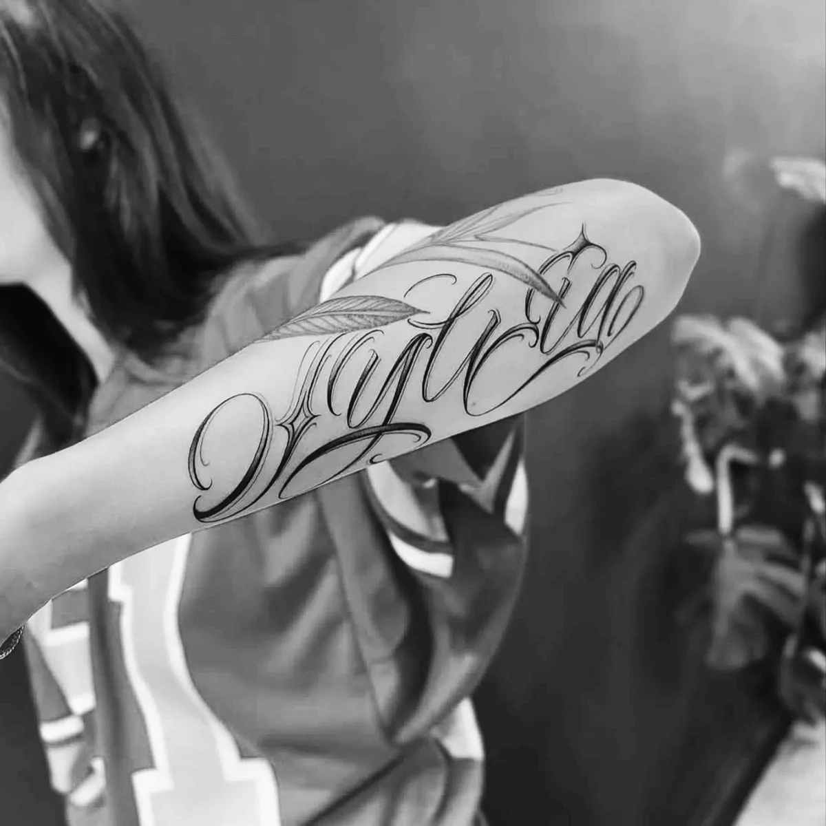 Custom script forearm tattoo, freshly healed