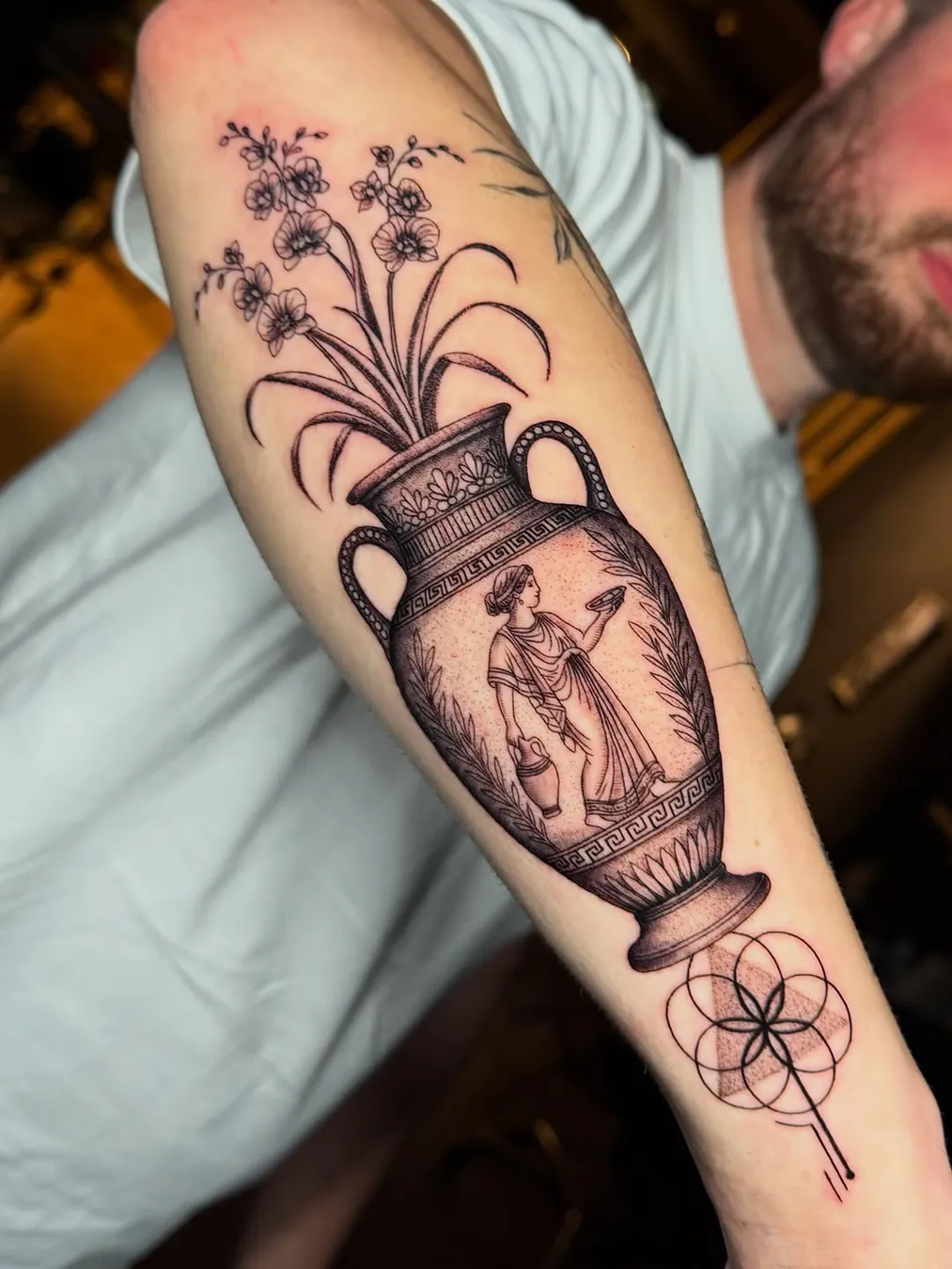 Greek vase with florals and geometry on forearm