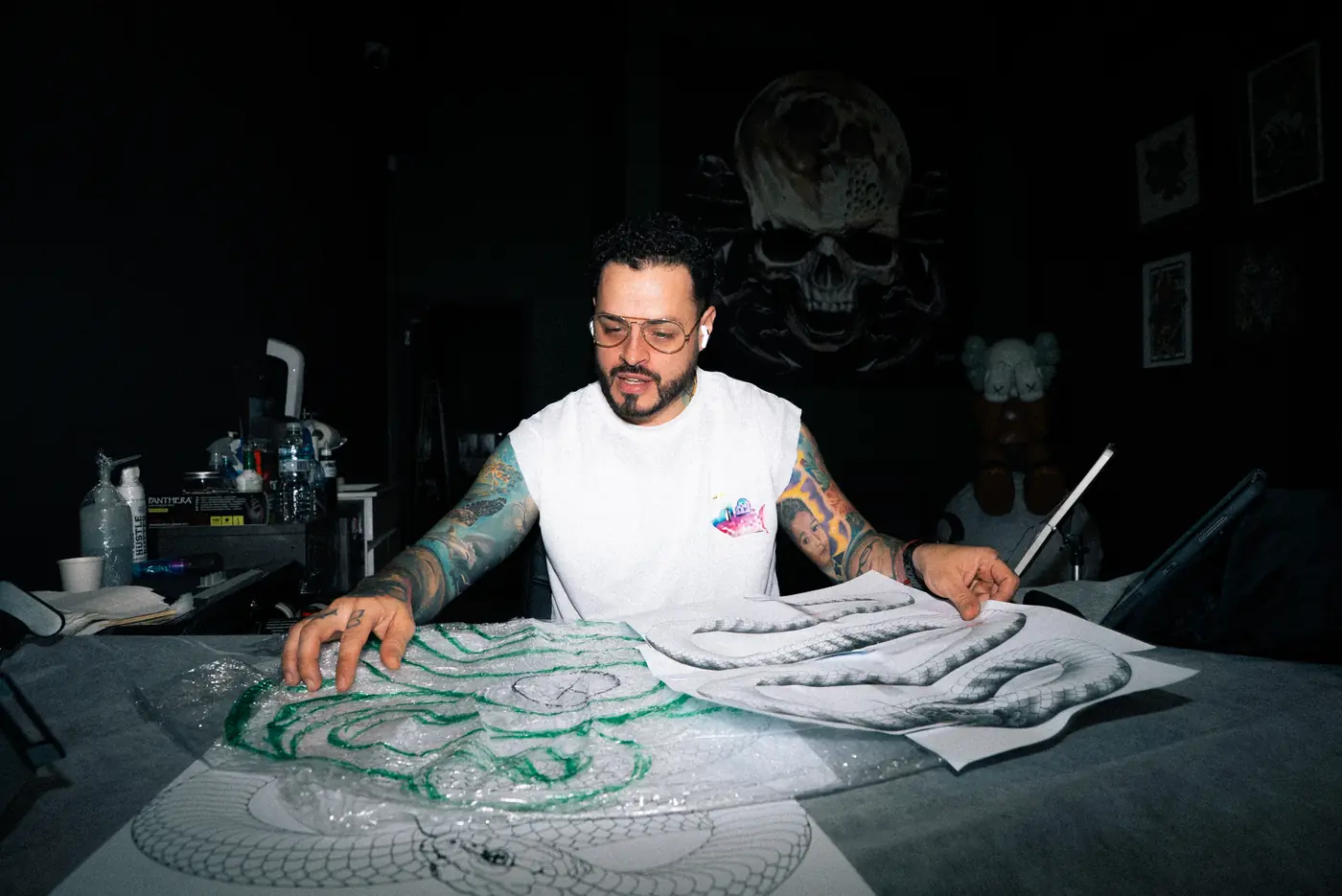 A Full Moon artist laying out stencils before a session